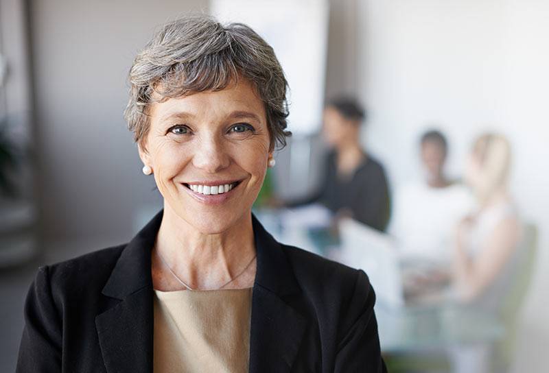 A military retiree working at her desk